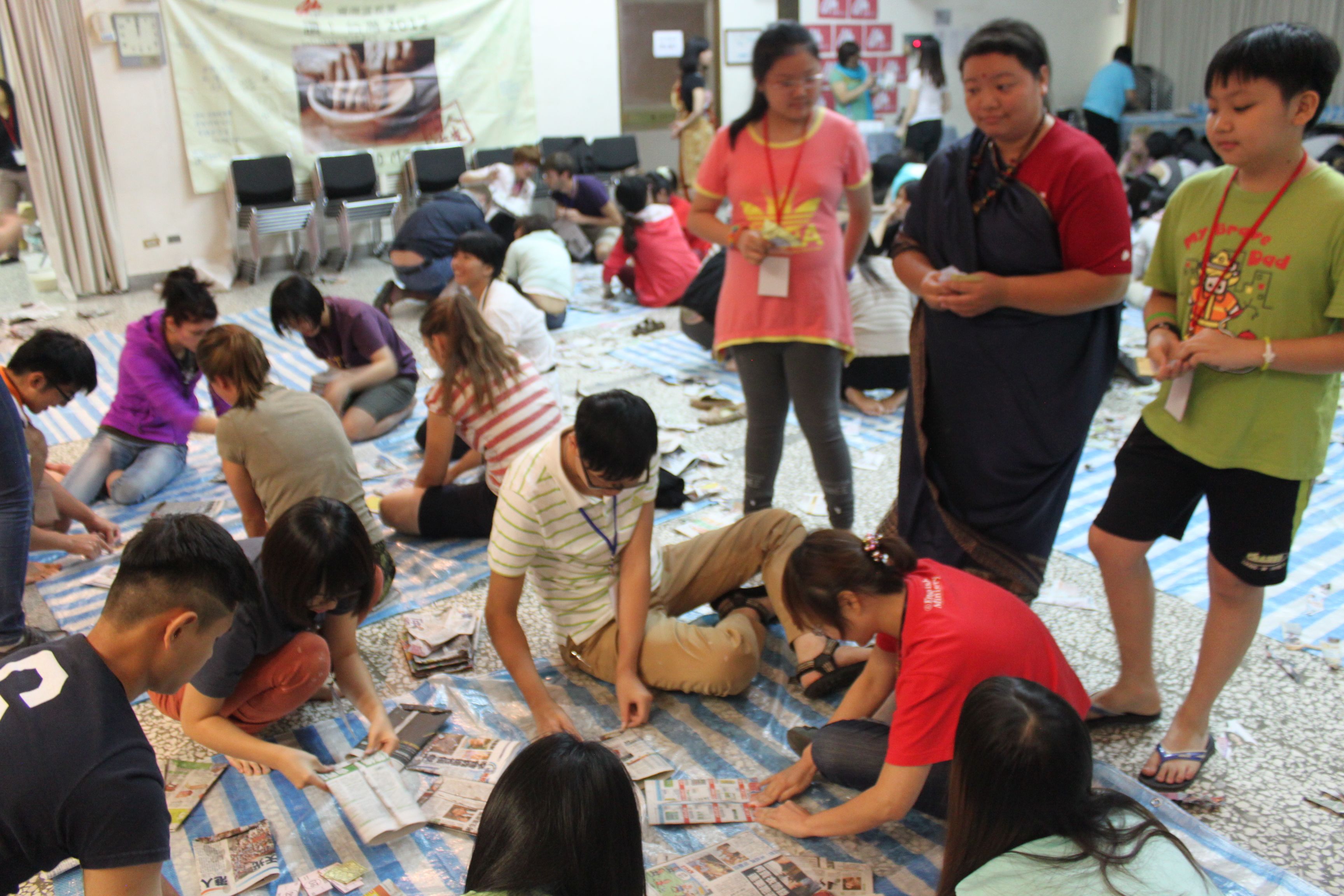 During the Poverty Simulation at STEP OUT, participants were asked to make paper bags in order to earn a living, thus simulating a real-life situation in a Bangladeshi slum.