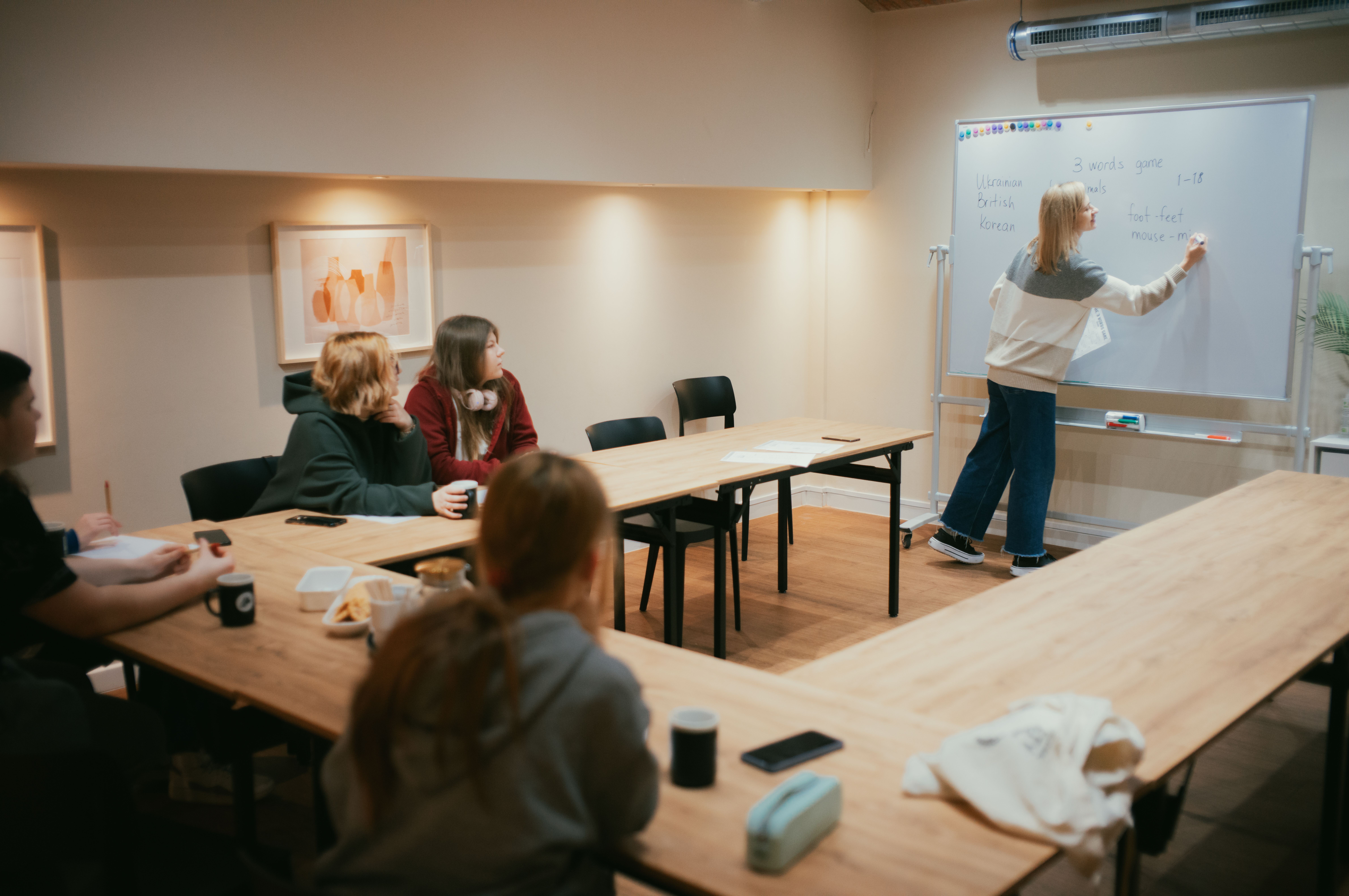 A team member teaches English to teenagers at OM's community centre in Poland. Photo by Lennard Prediger