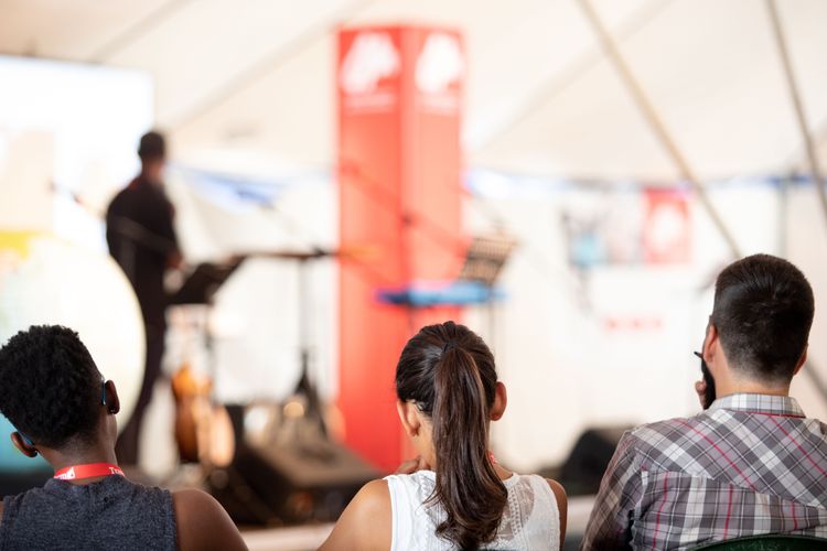 Transform participants listen to a speaker in Greece. Photo by Rebecca Rempel.