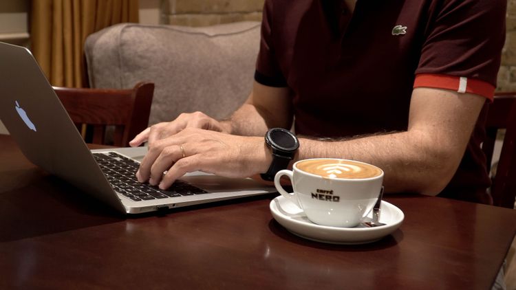 A marketplace worker spends the afternoon doing his job remotely from a local coffee shop. Photo by Jay S.
