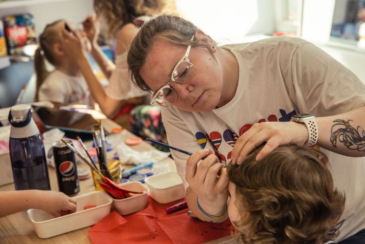 Celebrating children's day with games, balloons, face painting, and much more! Photo by Piotr Baczewski