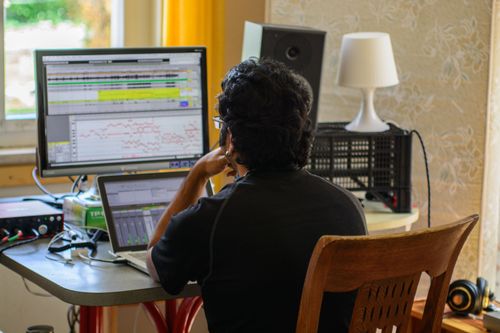 OM Arts co-director Dileep mixes the sound recordings for OM Arts Incarnate.  
Photo by Garrett Nasrallah