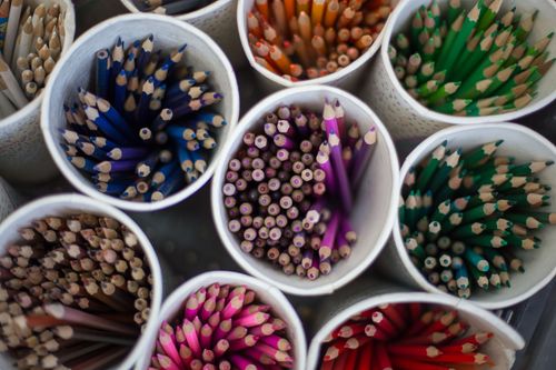 Pots of coloured pencils stand ready for use in an MK school in Central Asia.