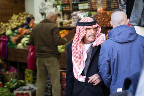 A man walks through the market. Photo by Rebecca Rempel.