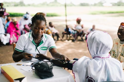 A woman gets her blood pressure checked at a medical outreach to the northern part of Ghana. Photo by Doseong Park.