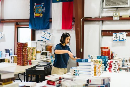 A STEP (short term exposure programme) volunteer sorts books in the Ships literature centre in Florence, USA.