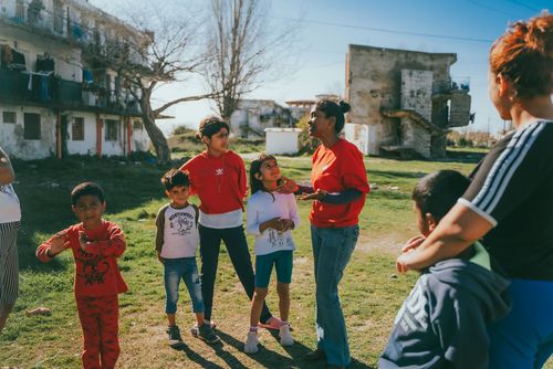 OM member picking up kids for a kids program in Vlores, albania. Kids are from Roma and Egyptian background