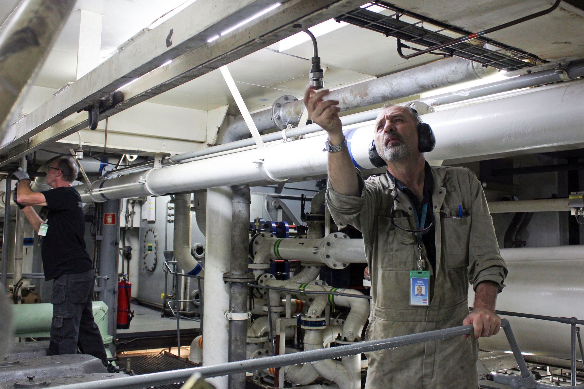 Willemstad, Curaçao :: Second Engineer Peter Huizinga (Netherlands) adjusts a HiFog sprinkler nozzle during testing.