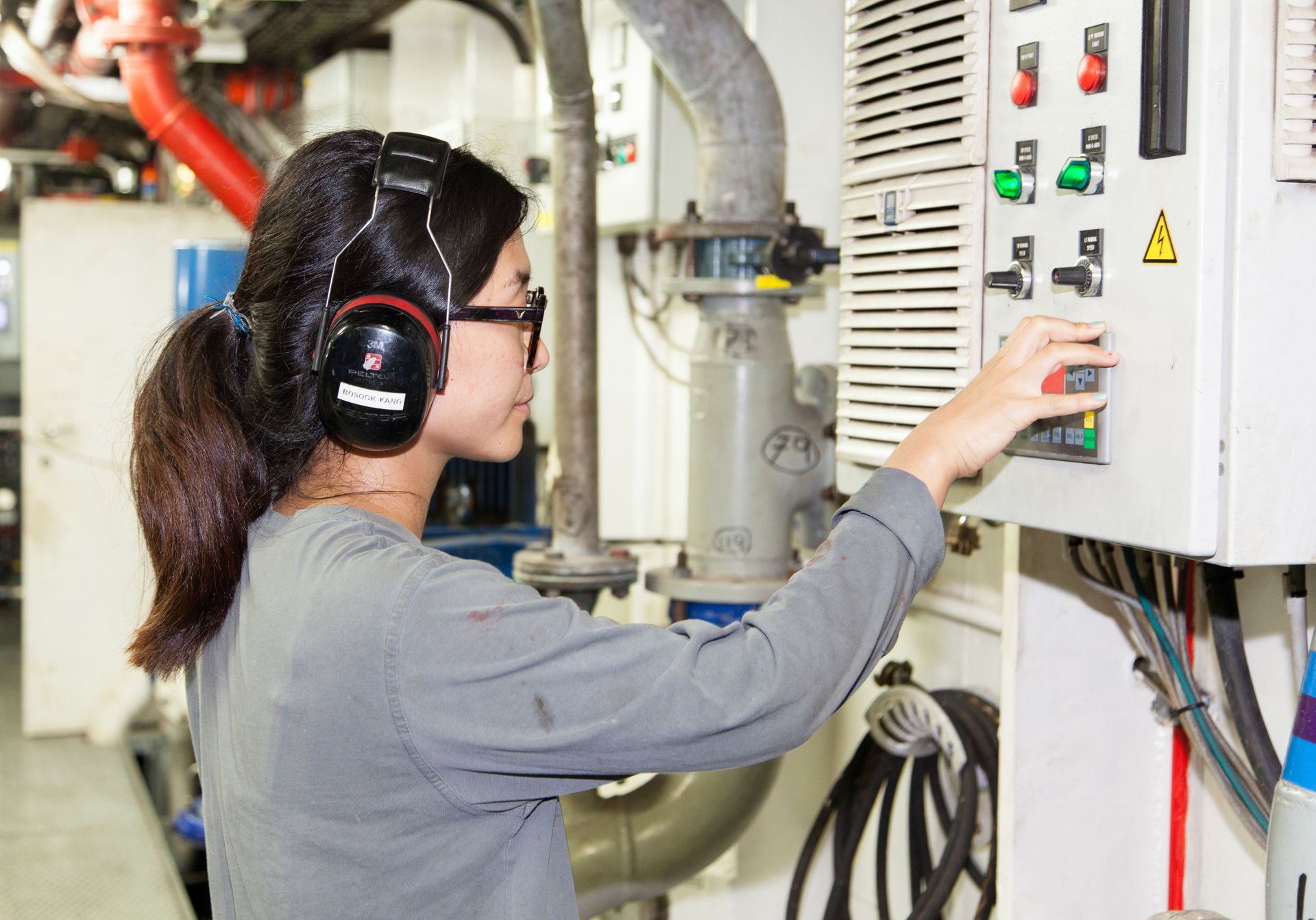 Cartagena, Colombia :: Second Engineer BoSook Kang (South Korea) in the engine room.