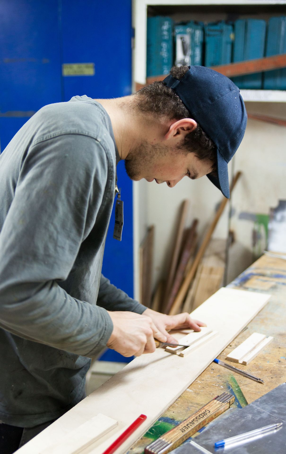 Cartagena, Colombia :: Andrin Zurbuchen (Switzerland) creates shelving in the carpentry workshop.