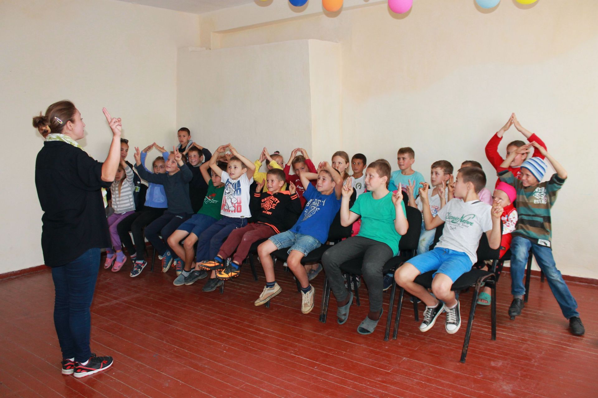 A participant of OM Moldova’s “Challenge into Missions” training leads a programme for underprivileged children during an outreach in a Moldovan village. The 10-week training course offers young Moldovans their first experience of missions. Seeing how God