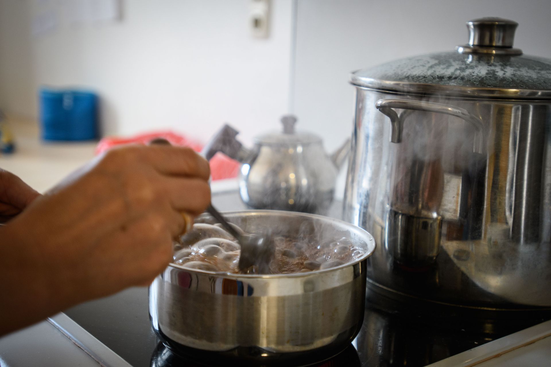 Making tea for a visiting friend after finding a place to live in peace
