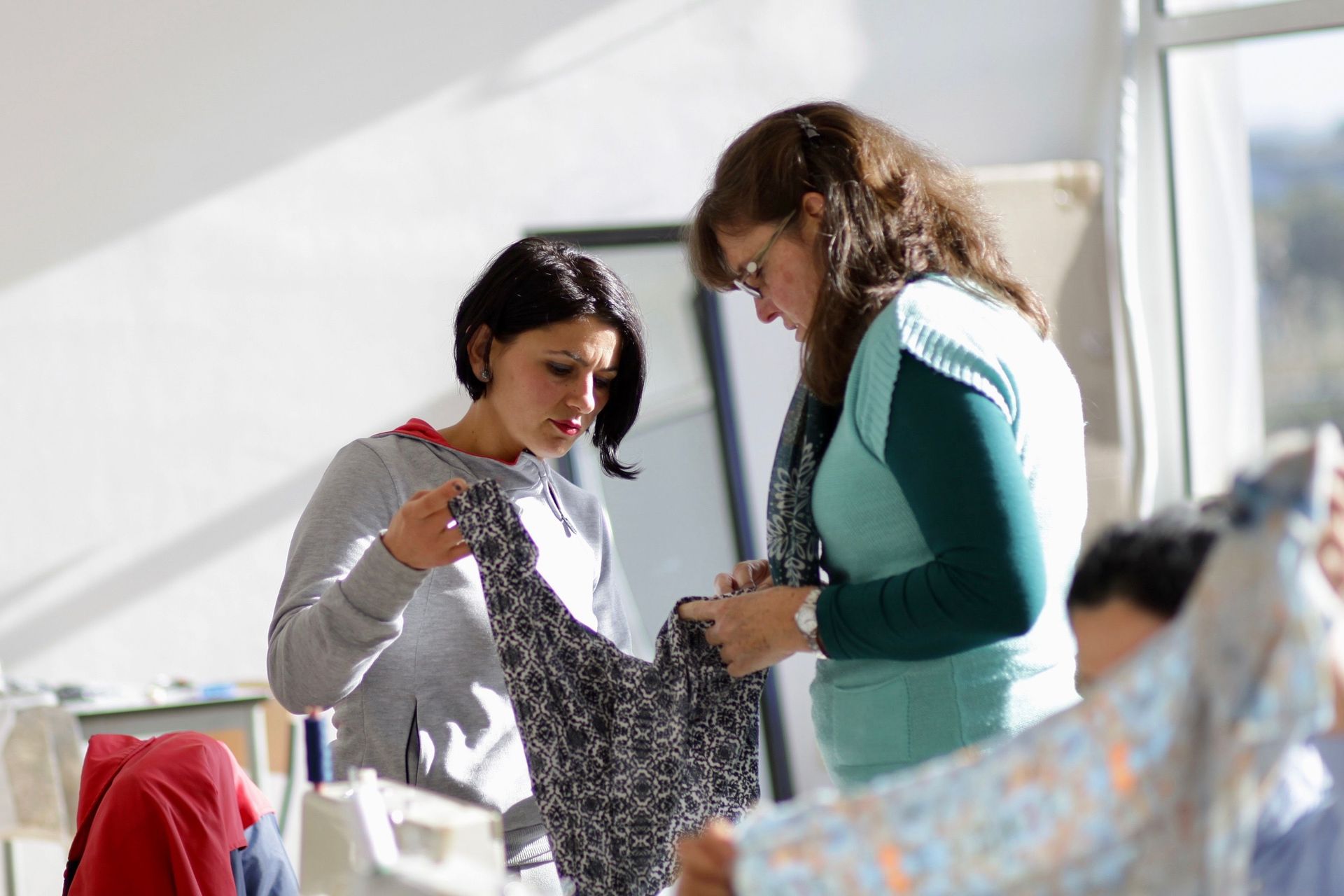 An OMer trains local Albanian women to sew, while leading Bible studies.