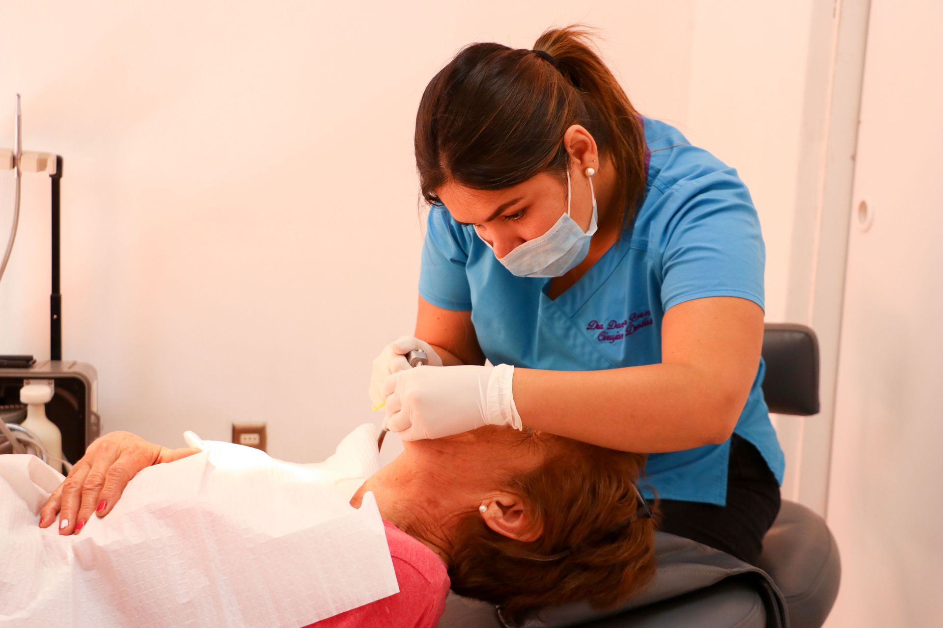Antofagasta, Chile :: Alongside crewmembers from Logos Hope, a dentist gives free dental care to a community.