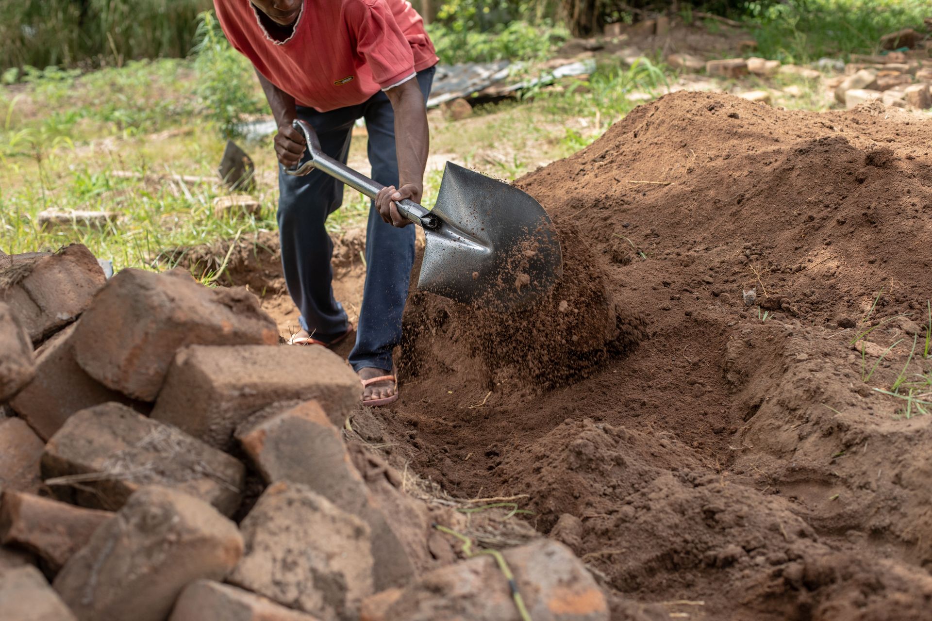 Men work to dig the foundation of a house on the OM base in Mozambique. Photo by Rebecca Rempel