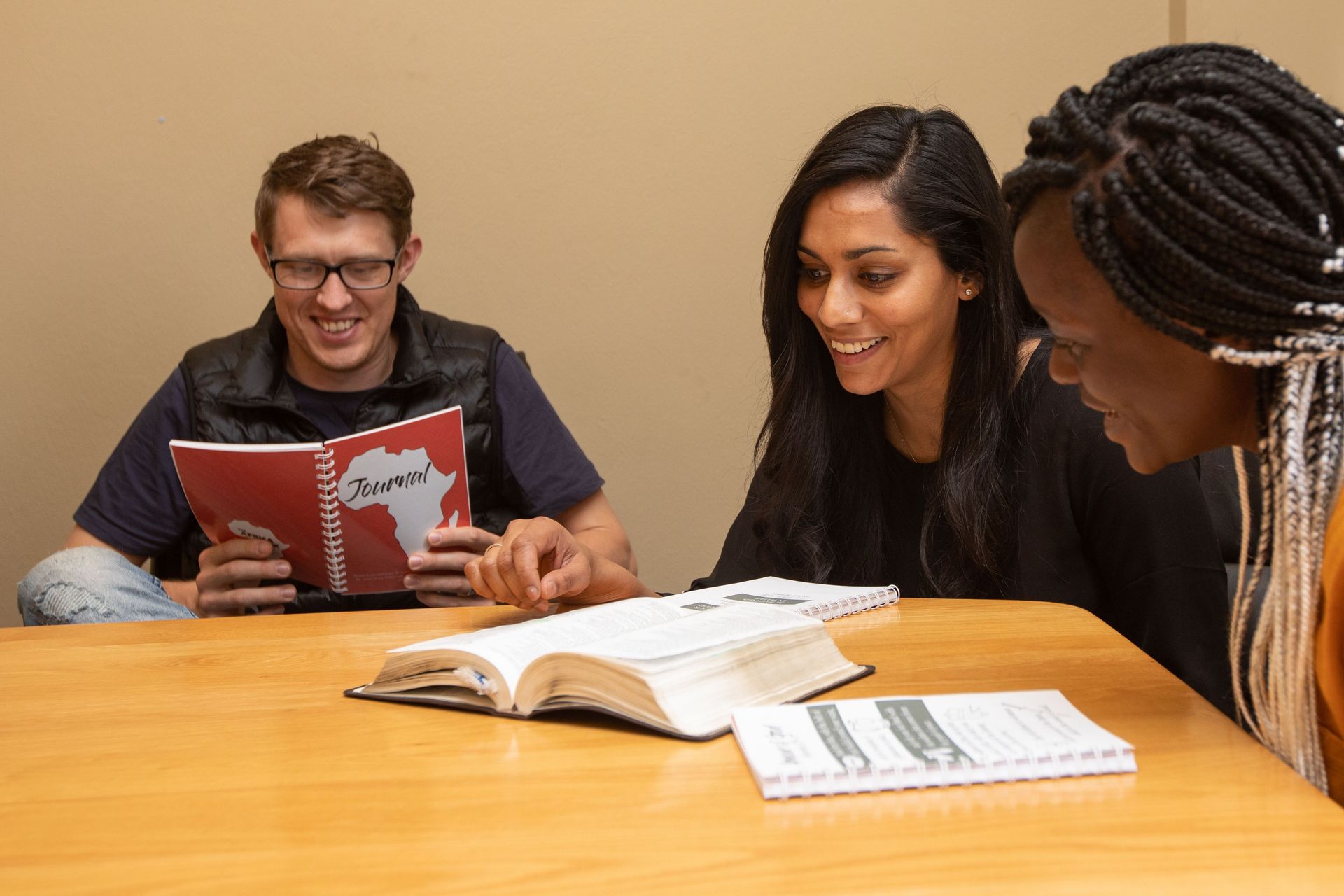 Vinitha Rodwell, centre, mentoring an Africa Trek intern. Vinitha and her husband, left, (both from Australia) lead the Africa Trek and are passionate about equipping young people to be leaders and disciple-makers. Photo by Rebecca Rempel.