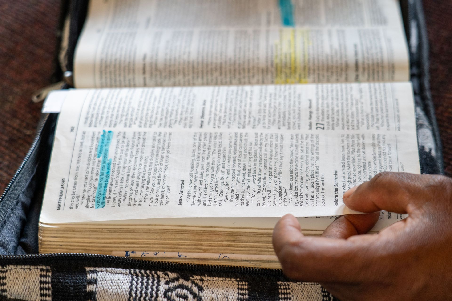 People page through the Bible. Photo by Rebecca Rempel.