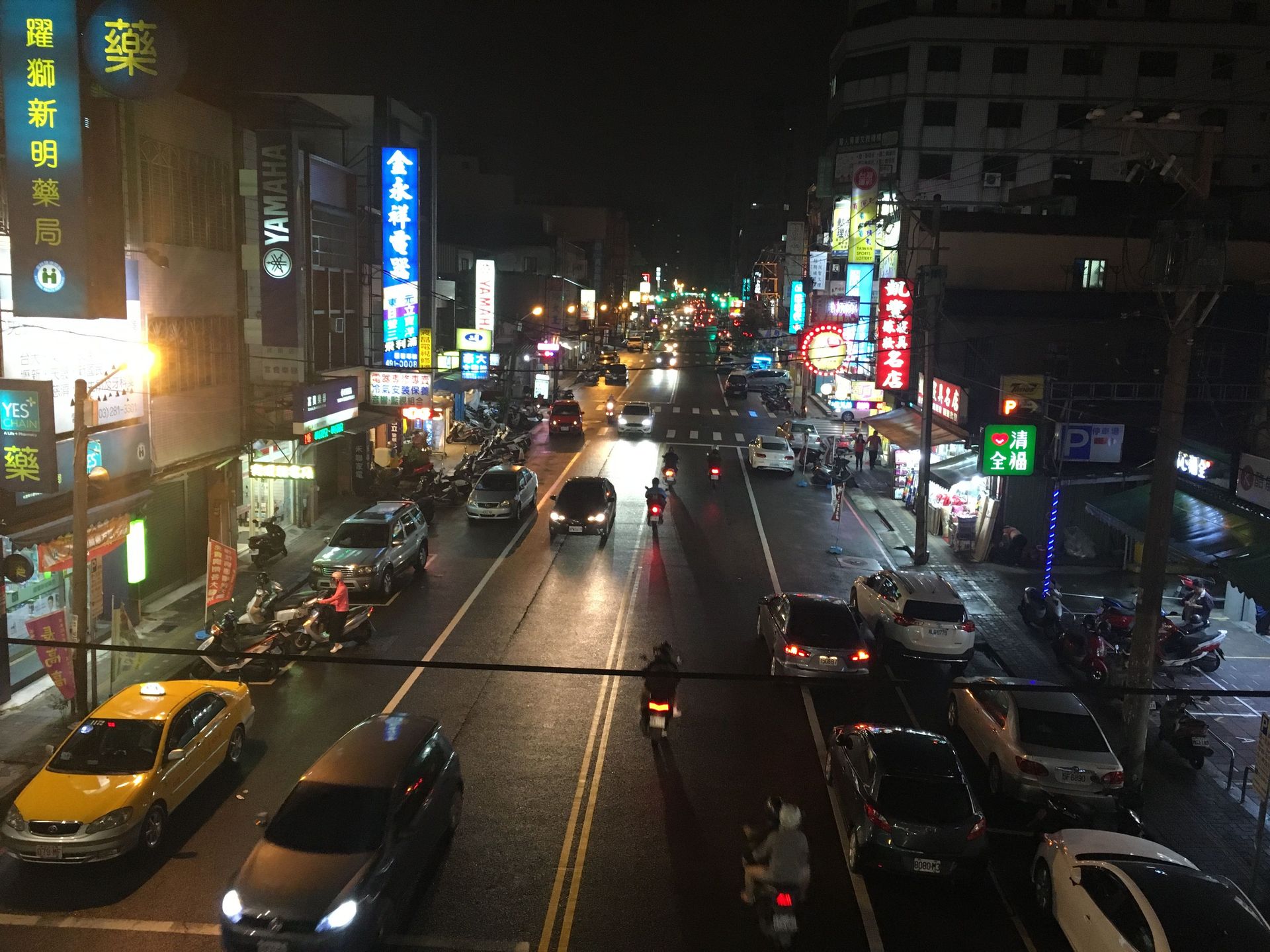 A street in Taiwan at night. Photo by Ellyn S.