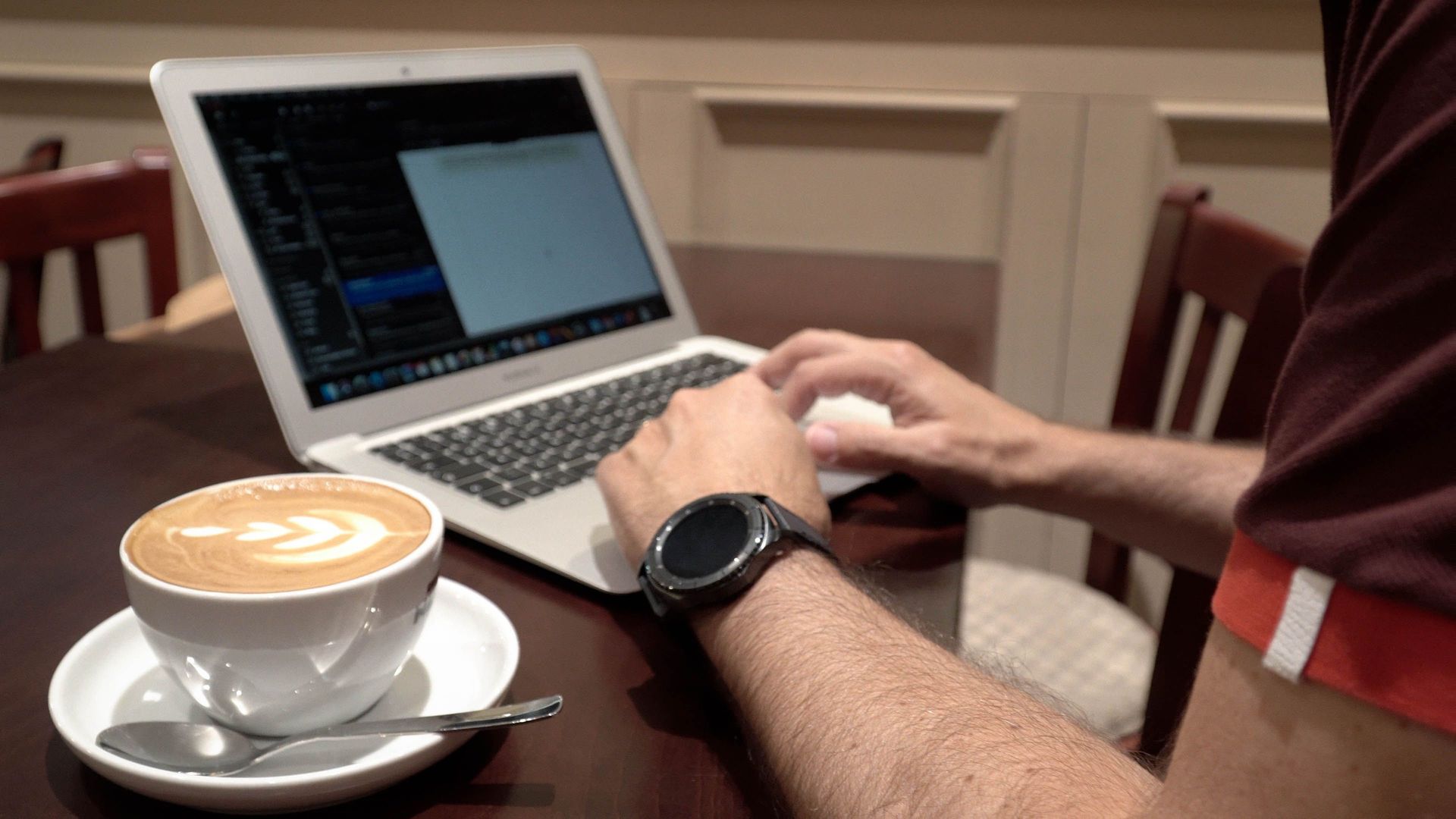 A marketplace worker spends an afternoon working remotely in a local coffee shop. Photo by Jay S.