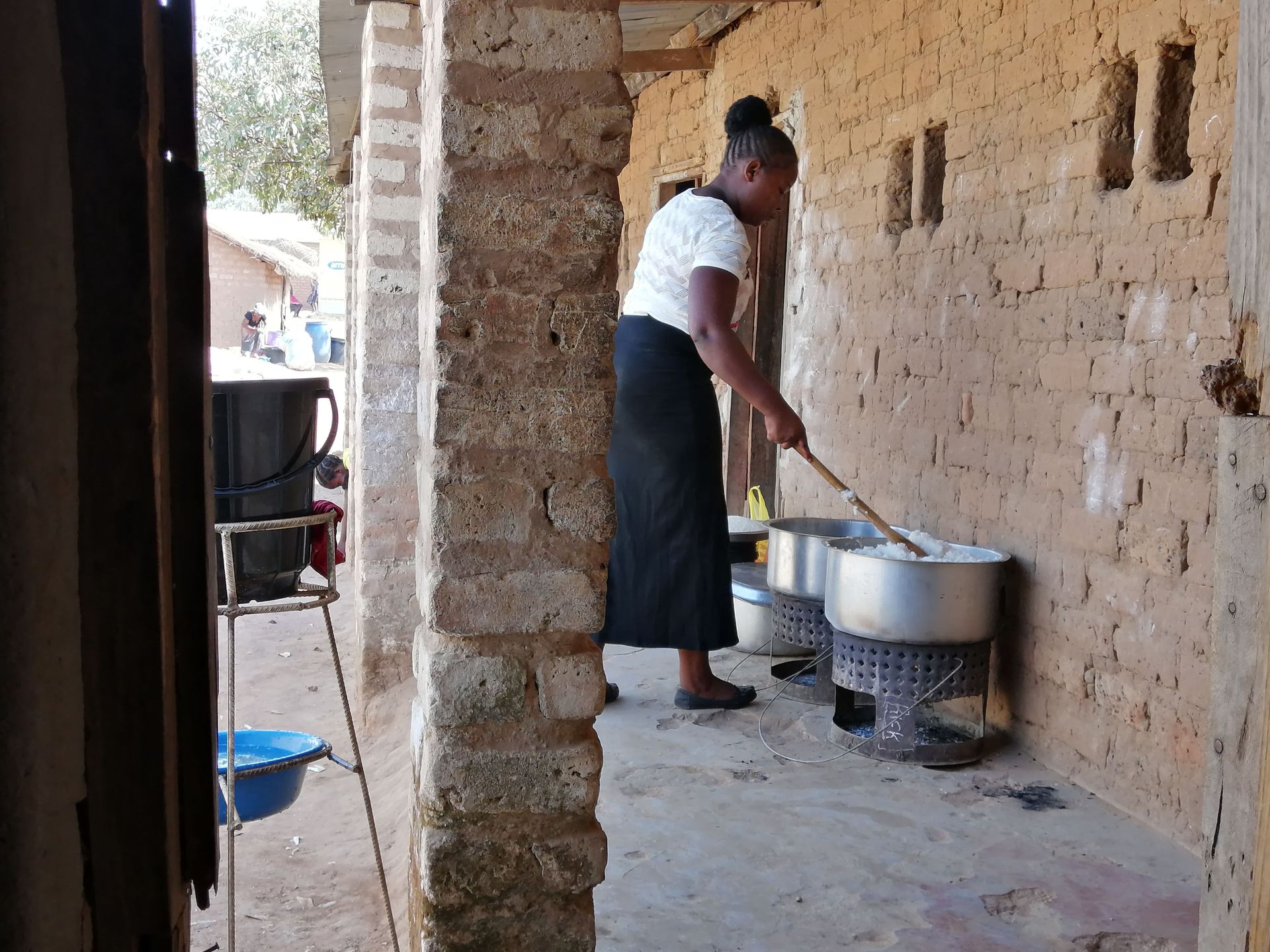 Woman cooking at Saikolo Community School in Kasama, Zambia.