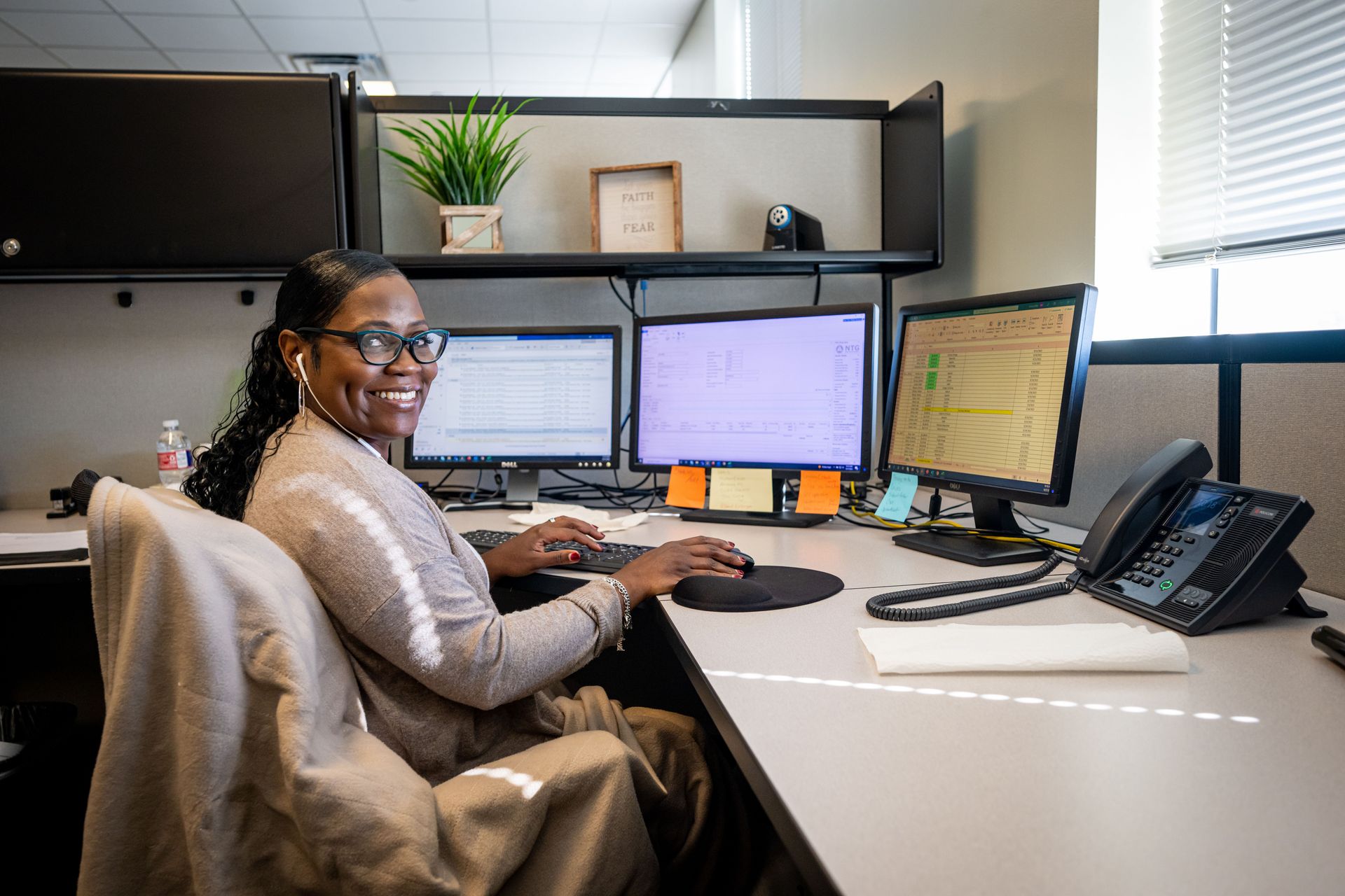 Woman working in an office space. Photo by Alex Coleman.