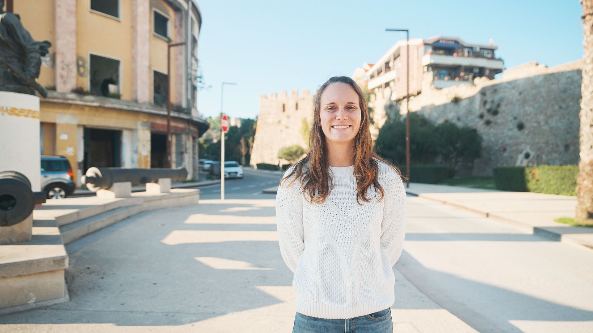 Vlorë, Albania :: Katie smiles in the sunlit streets of Vlorë during a ship visit there