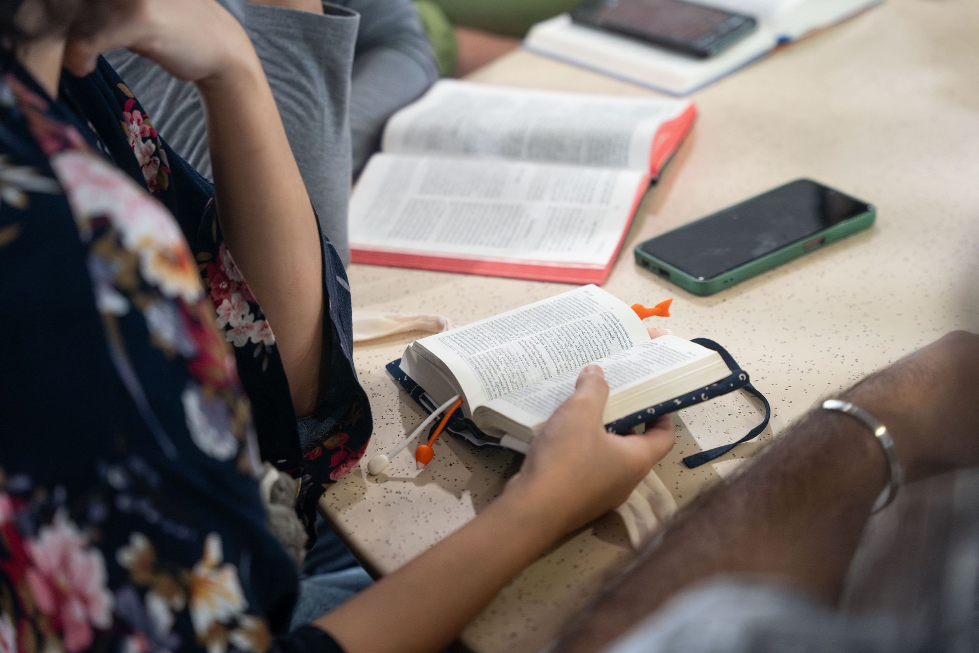 A group of young people study the Bible together. Photo by RJ Rempel.