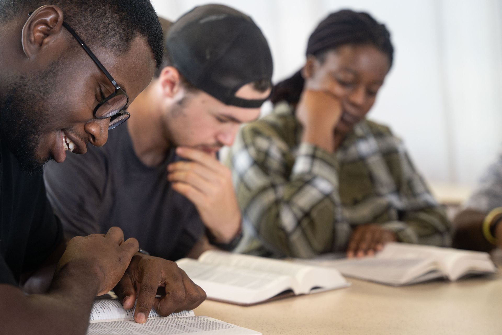 A group of young people study the Bible together. Photo by RJ Rempel.