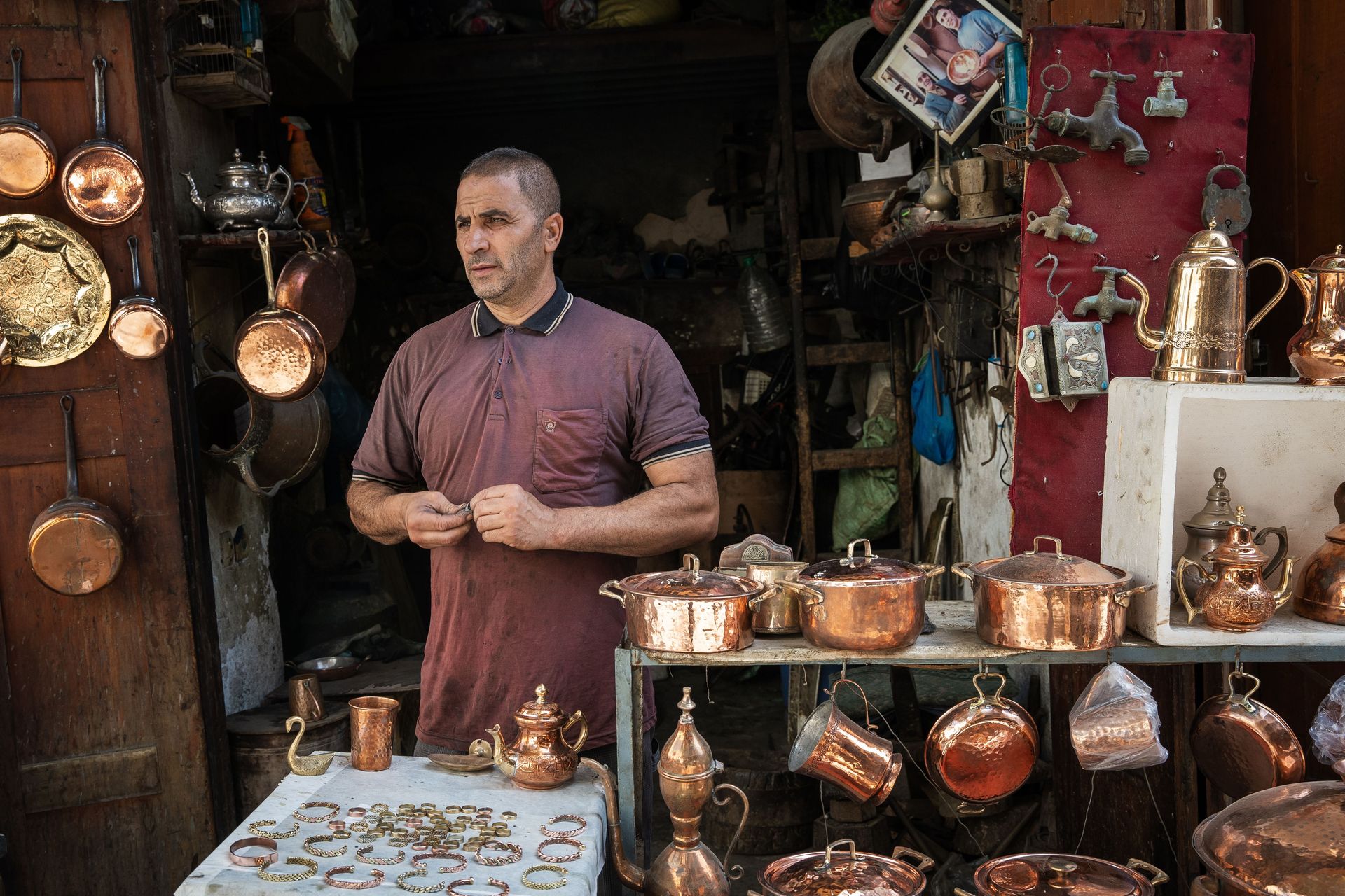 A man stands outside of his shop in Fes, Morocco. Photo by RJ Rempel.