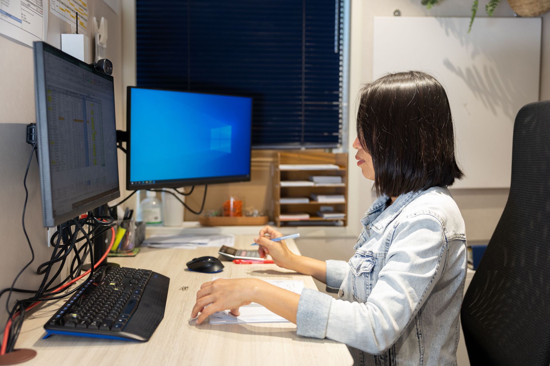 A woman from the Philippines works in the finance office. Photo by RJ Rempel.