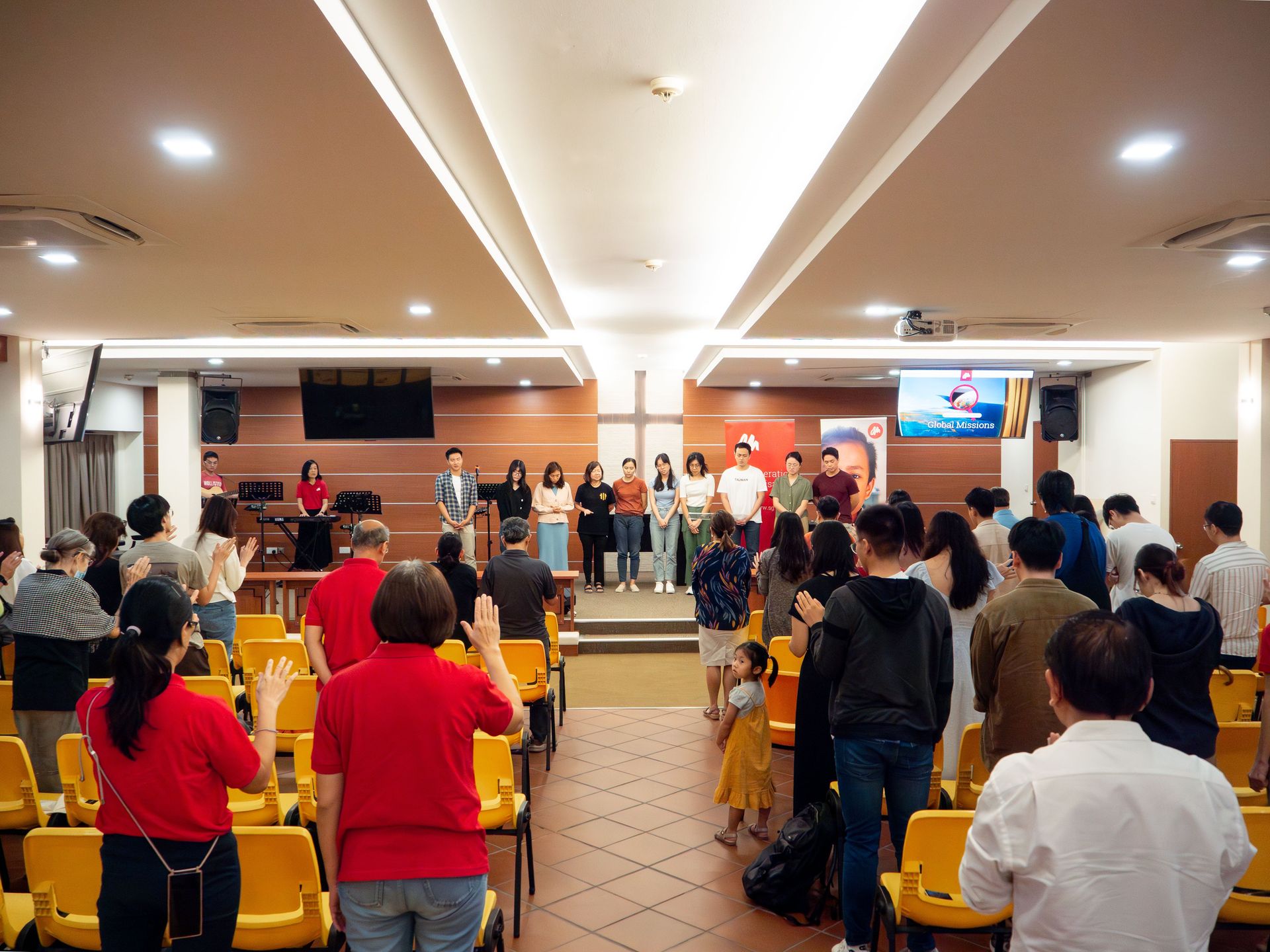Friends and family in Singapore gather to commission new short-term OM workers. Photo by Belva Loke.