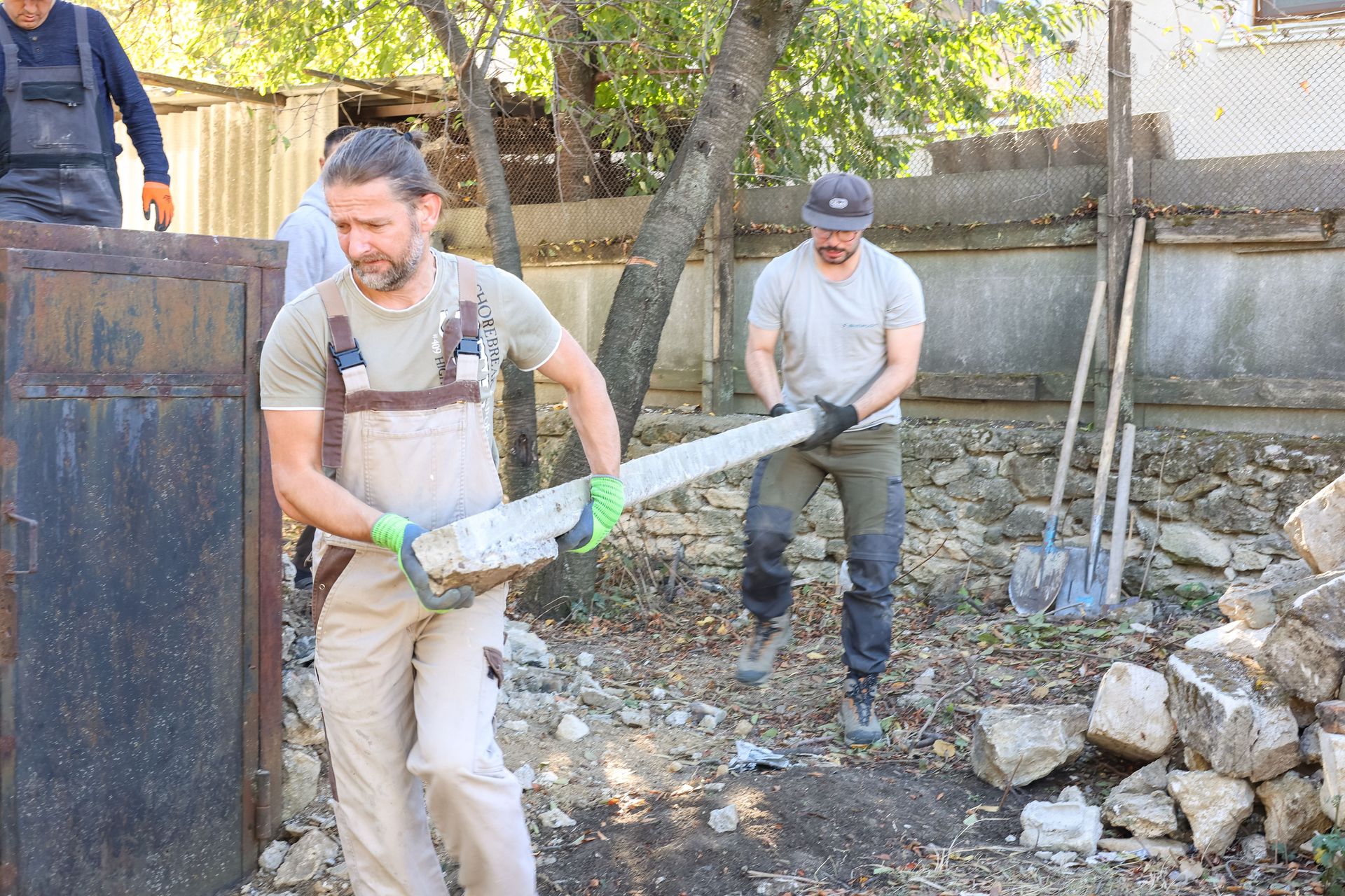 Men on a short term trip provide practical aid by helping clear some rubble. Photo by Jordan Wilkinson.