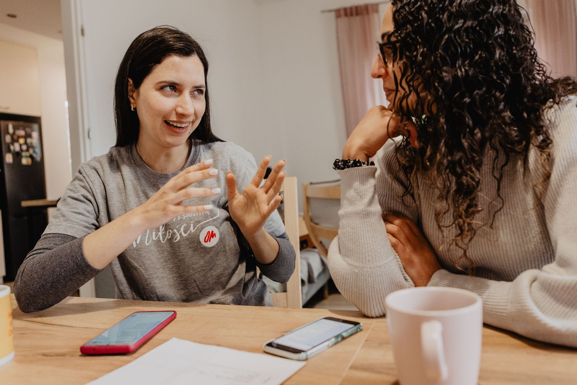 A short-term volunteer talks with an OM team member as they prepare for the week's outreach programme. Photo by Aneta Wigłasz